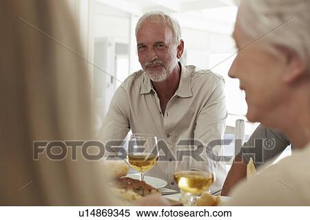 Mature man having a meal View Large Photo Image Stock Photography - Mature man having a meal. Fotosearch