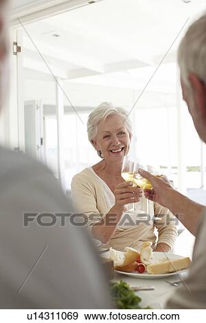 Mature woman celebrating View Large Photo Image Stock Photo - Mature woman celebrating. Fotosearch