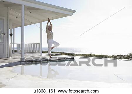 Mature woman doing yoga View Large Photo Image Stock Image - Mature woman doing yoga. Fotosearch