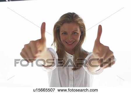 Model showing thumbs up View Large Photo Image Stock Photo - Model showing thumbs up. Fotosearch