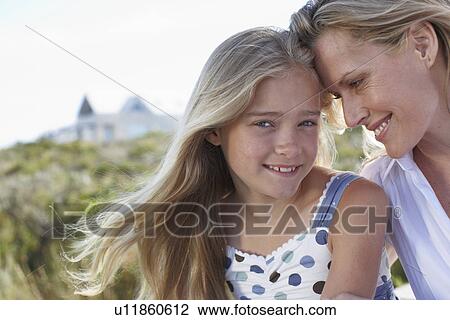 Mother and daughter close up View Large Photo Image Stock Image - Mother and daughter close up. Fotosearch