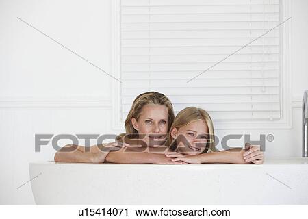 Mother and daughter smiling View Large Photo Image Stock Image - Mother and daughter smiling. Fotosearch