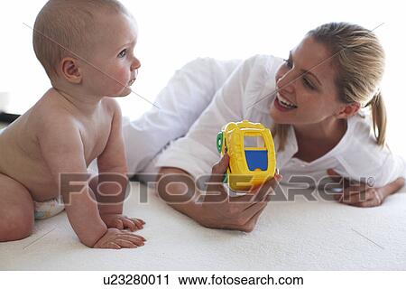 Mother with her baby View Large Photo Image Stock Image - Mother with her baby. Fotosearch