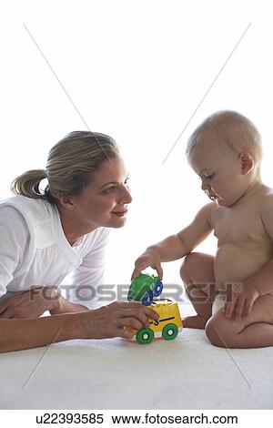 Mother with her newborn View Large Photo Image Stock Photography - Mother with her newborn. Fotosearch