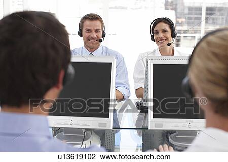 Motivated people at work View Large Photo Image Stock Image - Motivated people at work. Fotosearch