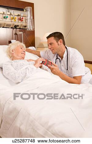 Stock Photo - Offering a present. Fotosearch