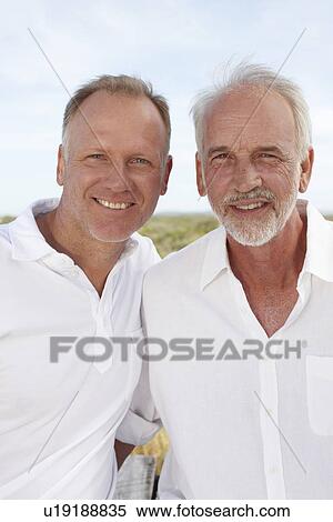 Stock Photography - Old man with his son. Fotosearch