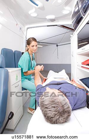 Paramedic holding patient's hand View Large Photo Image Stock Image - Paramedic holding patient's hand. Fotosearch