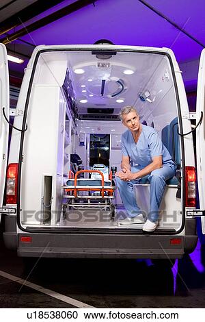 Paramedic in an ambulance car View Large Photo Image Stock Image - Paramedic in an ambulance car. Fotosearch