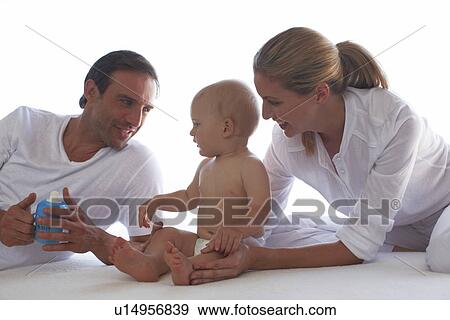 Parents with their newborn View Large Photo Image Stock Photo - Parents with their newborn. Fotosearch