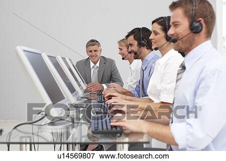 Stock Photo - People at work. Fotosearch