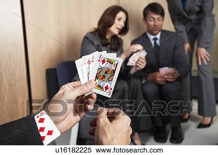 Playing with cards in the office View Large Photo Image Stock Photography - Playing with cards in the office. Fotosearch