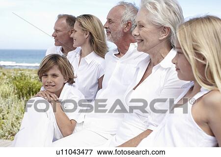 Stock Photo - Portrait of a boy with his family. Fotosearch