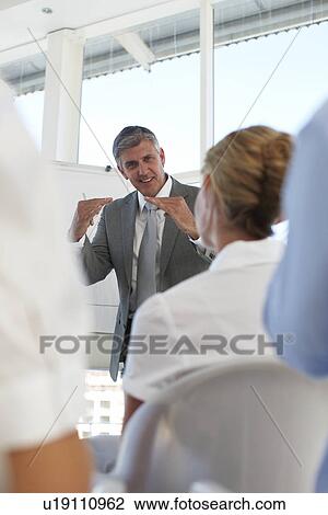 Stock Image - Presentation at a workshop. Fotosearch