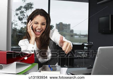 Pretty businesswoman doing OK sign View Large Photo Image Picture - Pretty businesswoman doing OK sign. Fotosearch