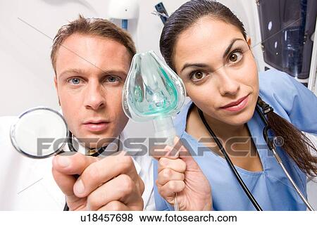 Putting an oxygen mask View Large Photo Image Stock Photo - Putting an oxygen mask. Fotosearch