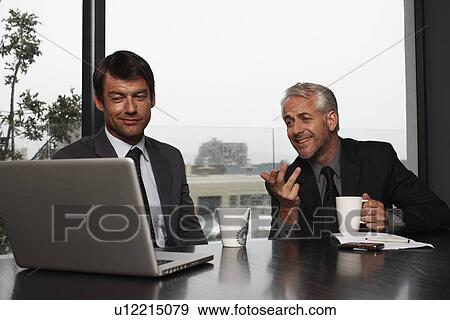 Stock Photo - Relaxed businessmen. Fotosearch