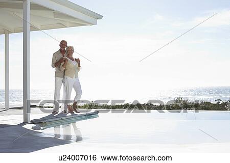 Retired couple at their beach house View Large Photo Image Stock Photograph - Retired couple at their beach house. Fotosearch