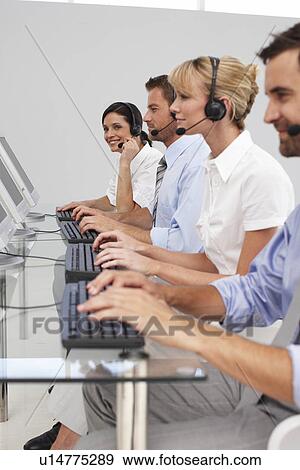 Sales people at work View Large Photo Image Stock Photo - Sales people at work. Fotosearch