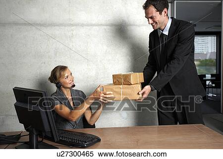 Stock Photography - Secretary accepting a package. Fotosearch