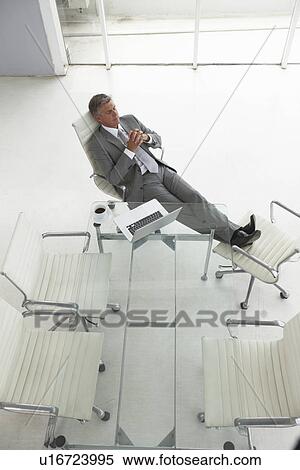 Stock Photography - Senior businessman relaxing. Fotosearch
