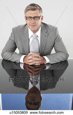 Senior executive in his office View Large Photo Image Stock Photo - Senior executive in his office. Fotosearch