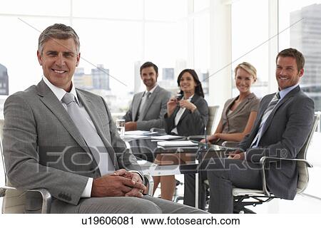 Senior executive with his team View Large Photo Image Stock Image - Senior executive with his team. Fotosearch