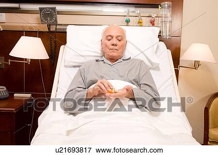 Senior taking medicine View Large Photo Image Stock Photo - Senior taking medicine. Fotosearch