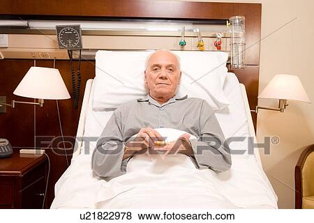 Senior taking pills View Large Photo Image Stock Photo - Senior taking pills. Fotosearch