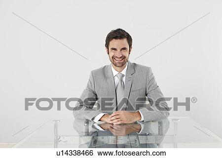 Sincere businessman smiling View Large Photo Image Stock Photograph - Sincere businessman smiling. Fotosearch