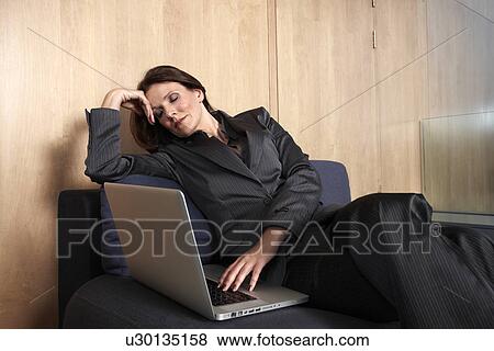 Sleepy business woman View Large Photo Image Stock Photo - Sleepy business woman. Fotosearch