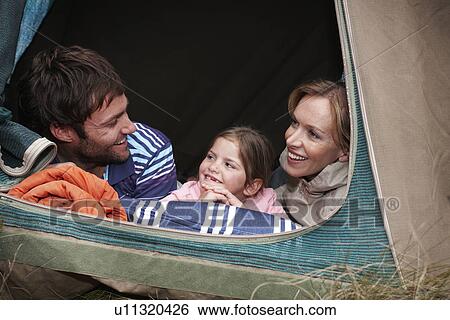 Stock Photograph - Small family camping. Fotosearch