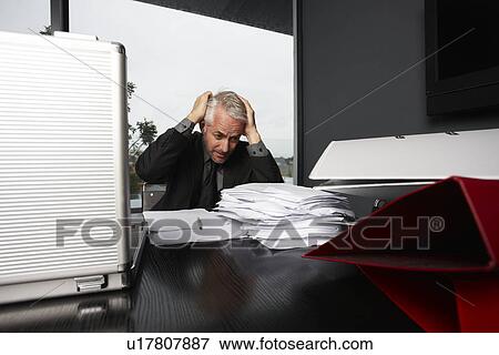 Stressed senior businessman View Large Photo Image Stock Photo - Stressed senior businessman. Fotosearch