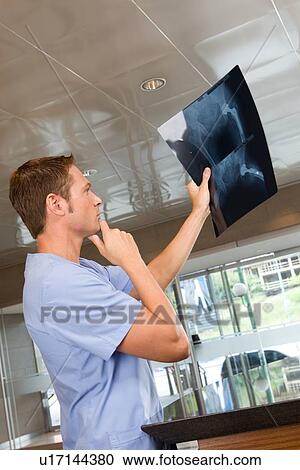 Stock Image - Surgeon at work. Fotosearch