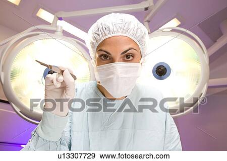 Surgeon at work View Large Photo Image Stock Photo - Surgeon at work. Fotosearch