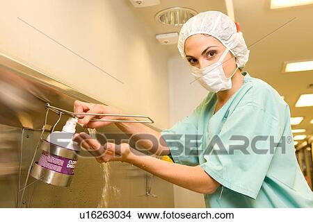 Picture - Surgeon washing her hands. Fotosearch