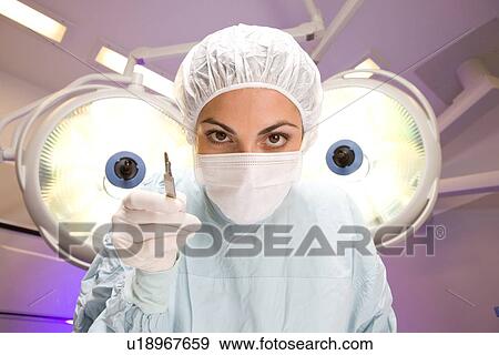 Surgeon with scalpel View Large Photo Image Stock Photo - Surgeon with scalpel. Fotosearch