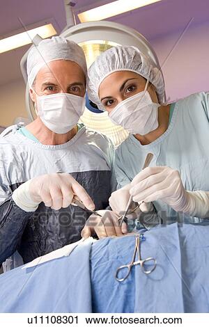 Stock Image - Surgeons at work portrait. Fotosearch