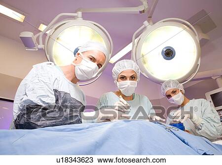 Surgeons at work View Large Photo Image Stock Image - Surgeons at work. Fotosearch