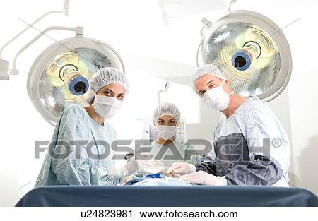 Surgeons at work View Large Photo Image Stock Image - Surgeons at work. Fotosearch