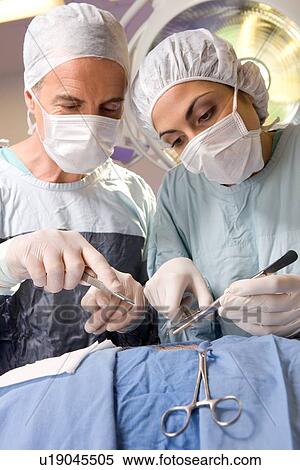 Stock Photography - Surgeons at work. Fotosearch