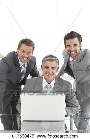 Stock Photo - Three businessmen. Fotosearch