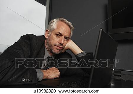 Tired businessman View Large Photo Image Stock Image - Tired businessman. Fotosearch