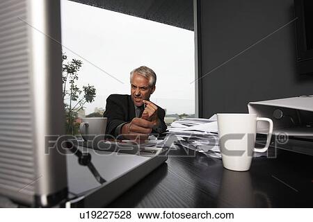 Stock Photo - Tired businessman. Fotosearch