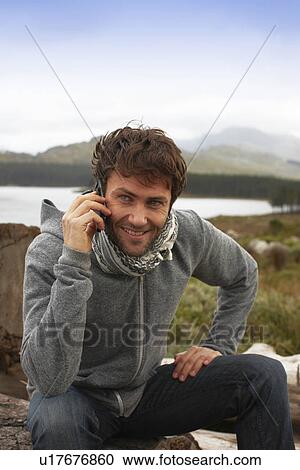 Stock Image - Tourist making a call. Fotosearch