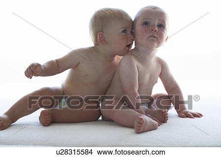 Picture - Two cute babies. Fotosearch