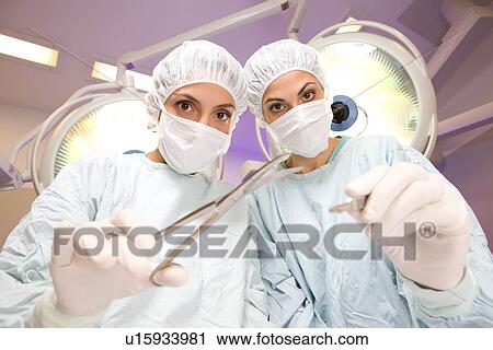 Two female surgeons View Large Photo Image Stock Image - Two female surgeons. Fotosearch