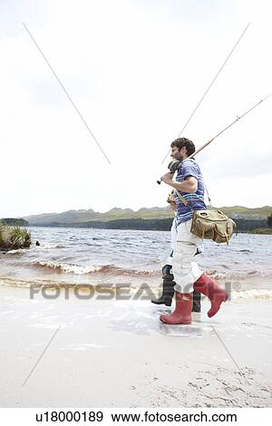 Stock Photo - Two fishermen walking. Fotosearch