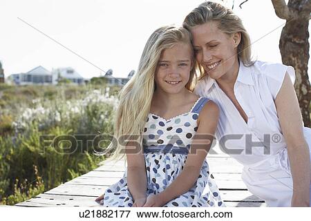 Stock Photo - Two generations. Fotosearch