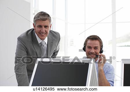 Stock Photography - Two men at work. Fotosearch